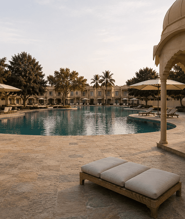 Pool and sun loungers at the Palm Resort